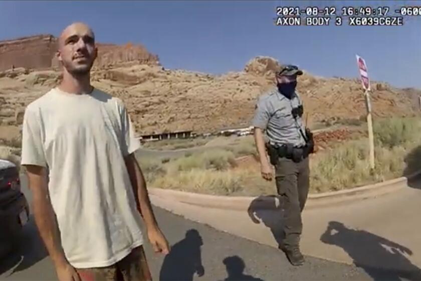 FILE - This Aug. 12, 2021 file photo from video provided by the Moab, Utah, Police Department shows Brian Laundrie talking to a police officer after police pulled over the van he was traveling in with his girlfriend, Gabrielle "Gabby" Petito, near the entrance to Arches National Park in Utah. The FBI on Thursday, Oct. 21, 2021, identified human remains found in a Florida nature preserve as those of Laundrie, a person of interest in the death of girlfriend Gabby Petito while the couple was on a cross-country road trip. (The Moab Police Department via AP, File)