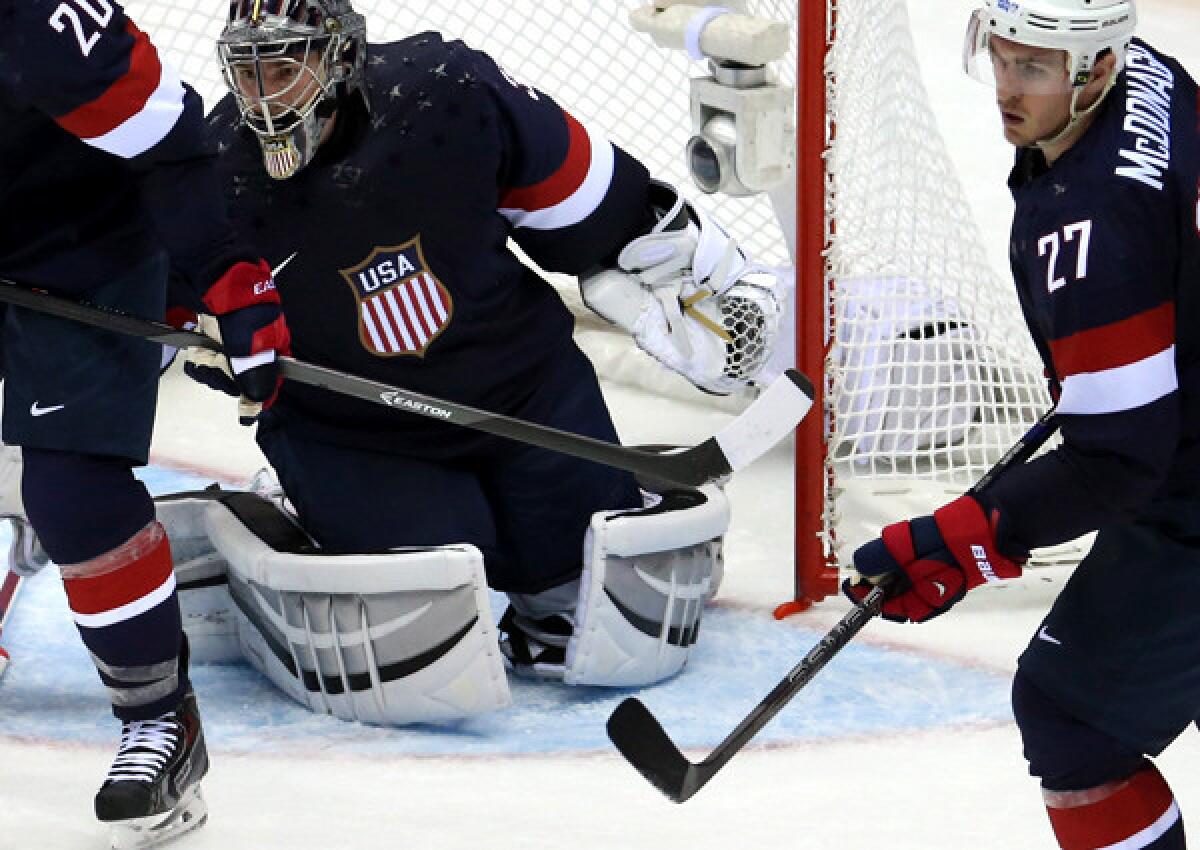 The net is off its mooring behind U.S. goalie Jonathan Quick before Russia scored a goal in the third period of a men's preliminary-round hockey game on Saturday at Bolshoy Ice Dome.