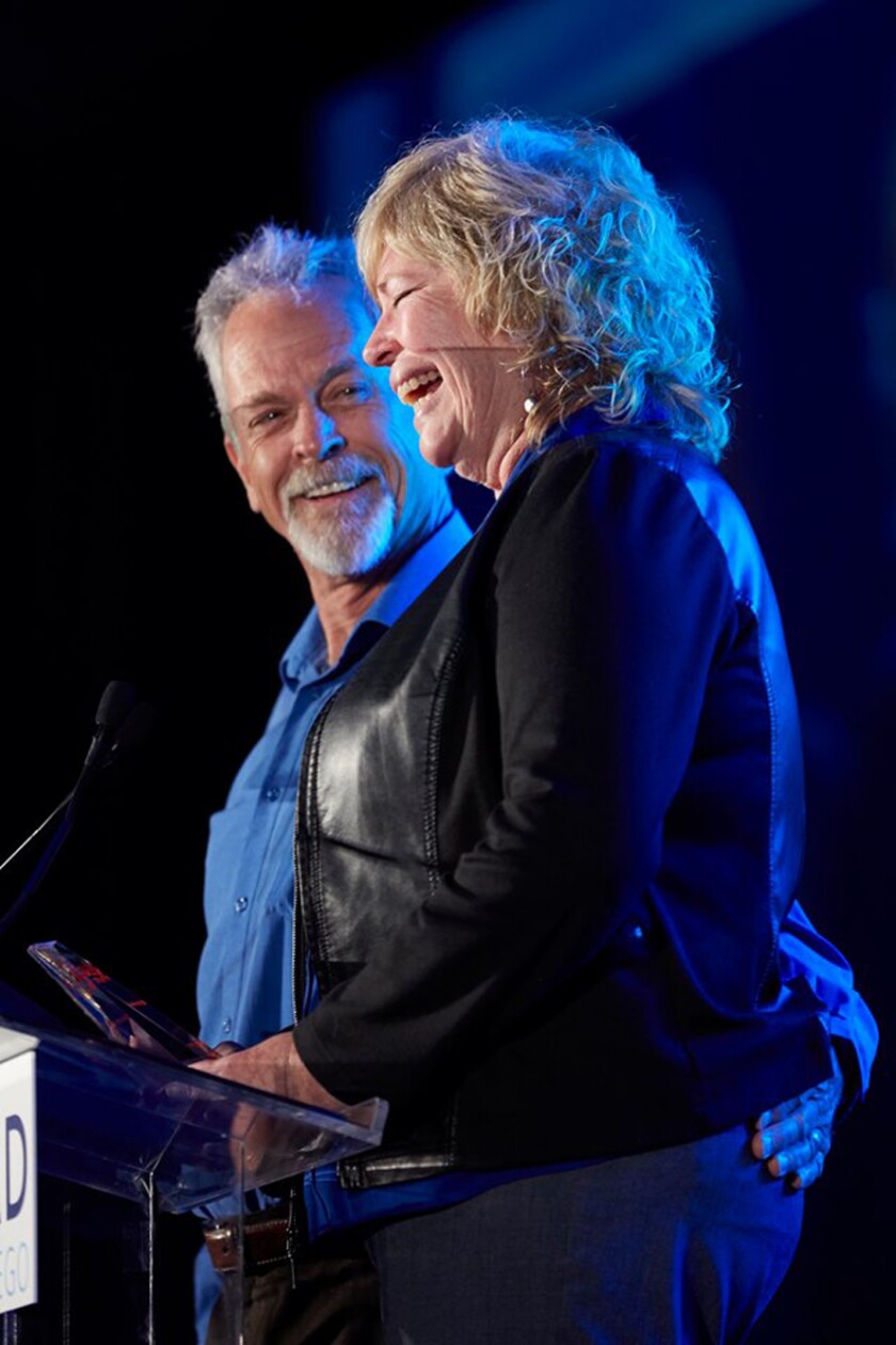 Steve and Mia Roseberry at the podium accepting LEAD San Diego's 2019 Visionary Award for Outstanding Community Service on June 6.