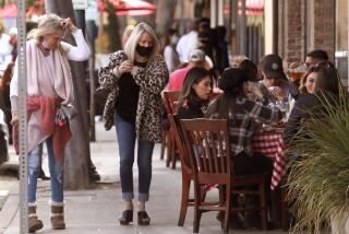 CLAREMONT, CA - People enjoy a meal as restaurants return to outdoor dining in The Village in downtown Claremont on Sunday, January 31, 2021. (Genaro Molina / Los Angeles Times)