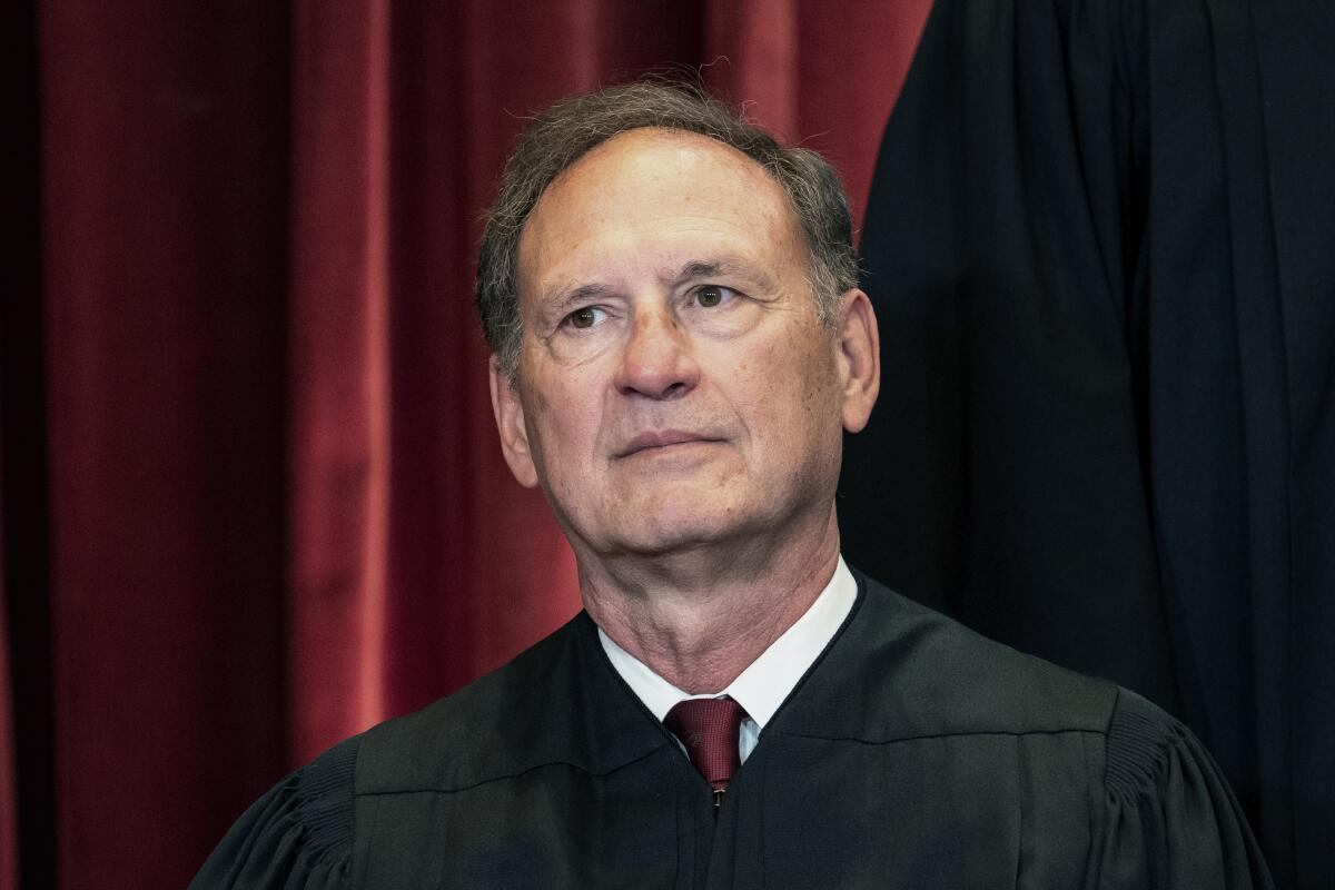 Samuel A. Alito Jr. sits for a group portrait of Supreme Court justices in 2021.