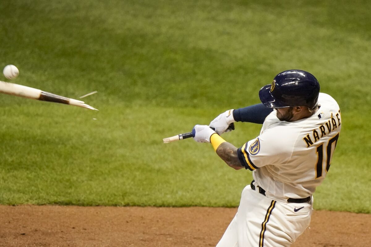 Milwaukee Brewers' Omar Narvaez hits a broken bat two-run scoring single during the fifth inning of a baseball game against the Detroit Tigers Wednesday, Sept. 2, 2020, in Milwaukee. (AP Photo/Morry Gash)