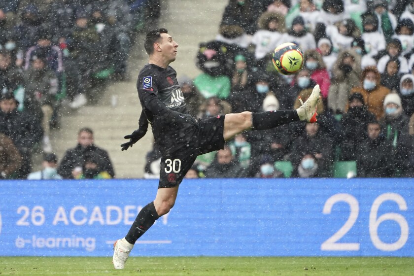 PSG's Lionel Messi controls the ball during the French League One soccer between Saint-Etienne and Paris Saint Germain, in Saint-Etienne, central France, Sunday, Nov. 28, 2021. (AP Photo/Laurent Cipriani)