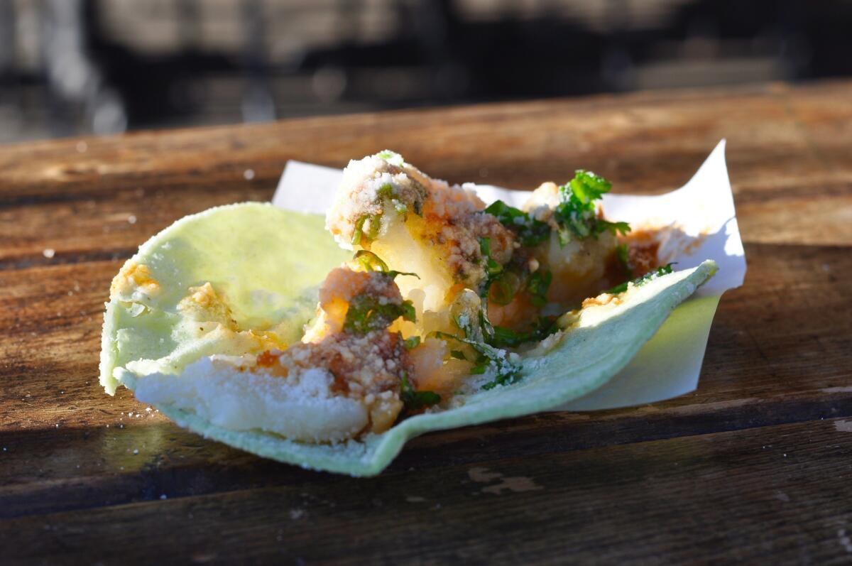 A potato taco on one of the outside patio tables at Best Fish Taco in Ensenada, in Los Feliz.