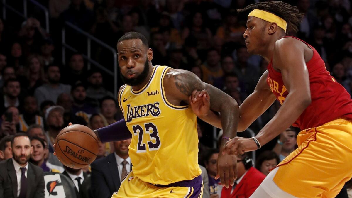Lakers forward LeBron James drives to the basket against Indiana Pacers center Myles Turner at Staples Center on Nov. 29.