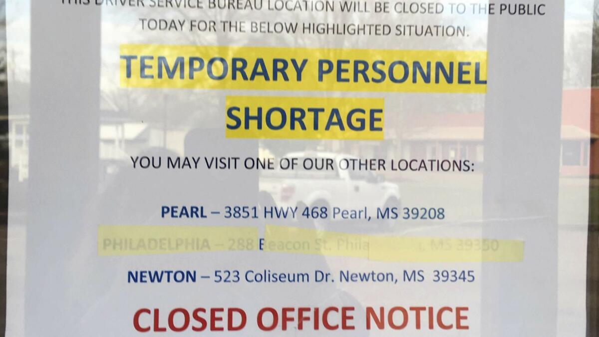 In this March 12 photograph, a sign shows that the driver's license station in Walnut Grove, Miss., is closed because of short staffing.