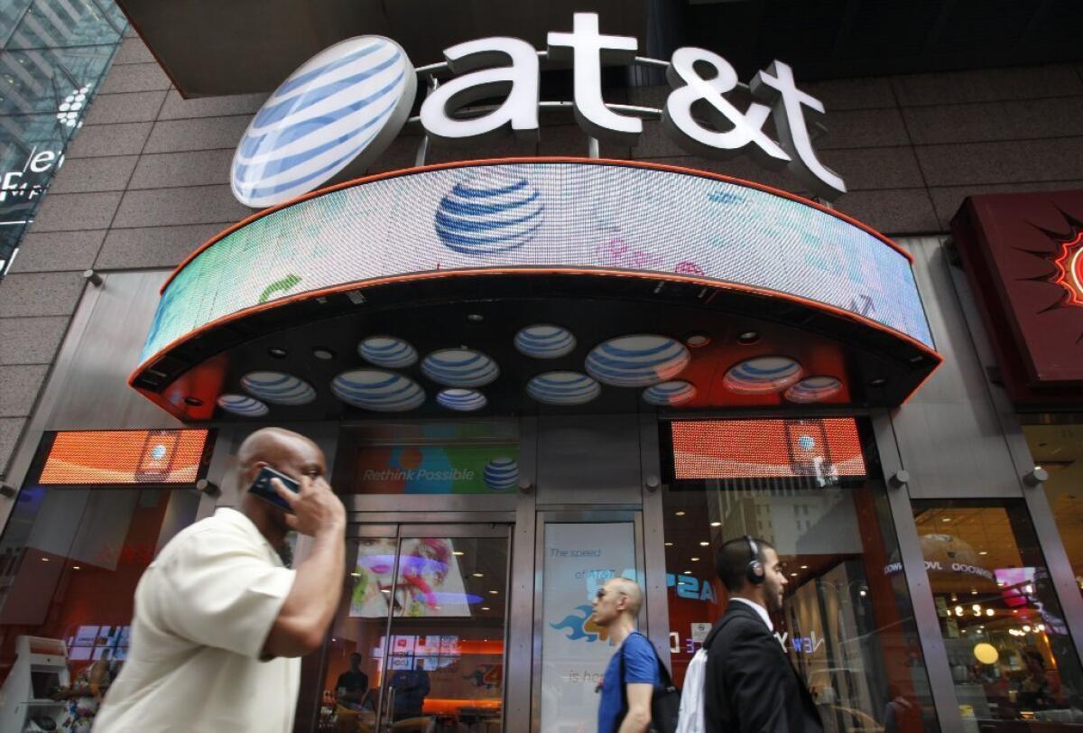 AT&T has cut prices on its family plans. Above, an AT&T store in New York.
