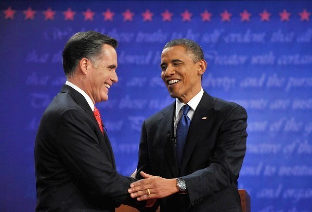 President Obama, right, and Republican challenger Mitt Romney shake hands following their first debate at the University of Denver in Colo. on Oct. 3.