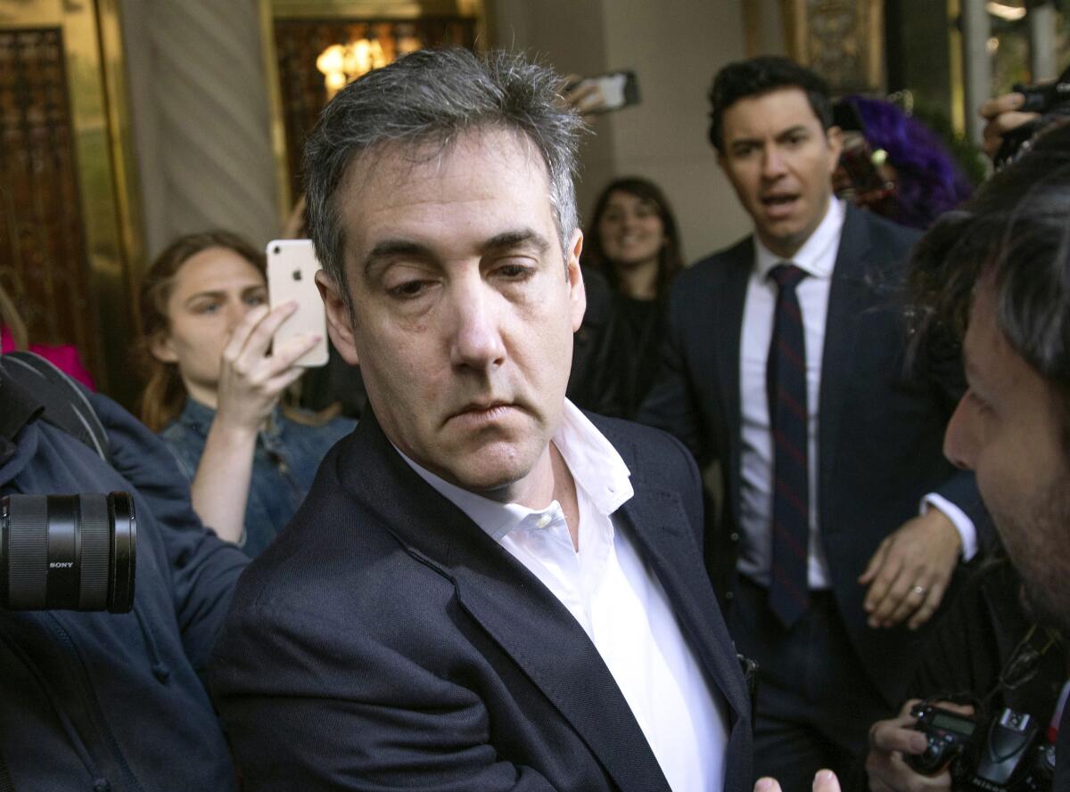 Michael Cohen, President Trump's former attorney, leaves his apartment building in May 2019.
