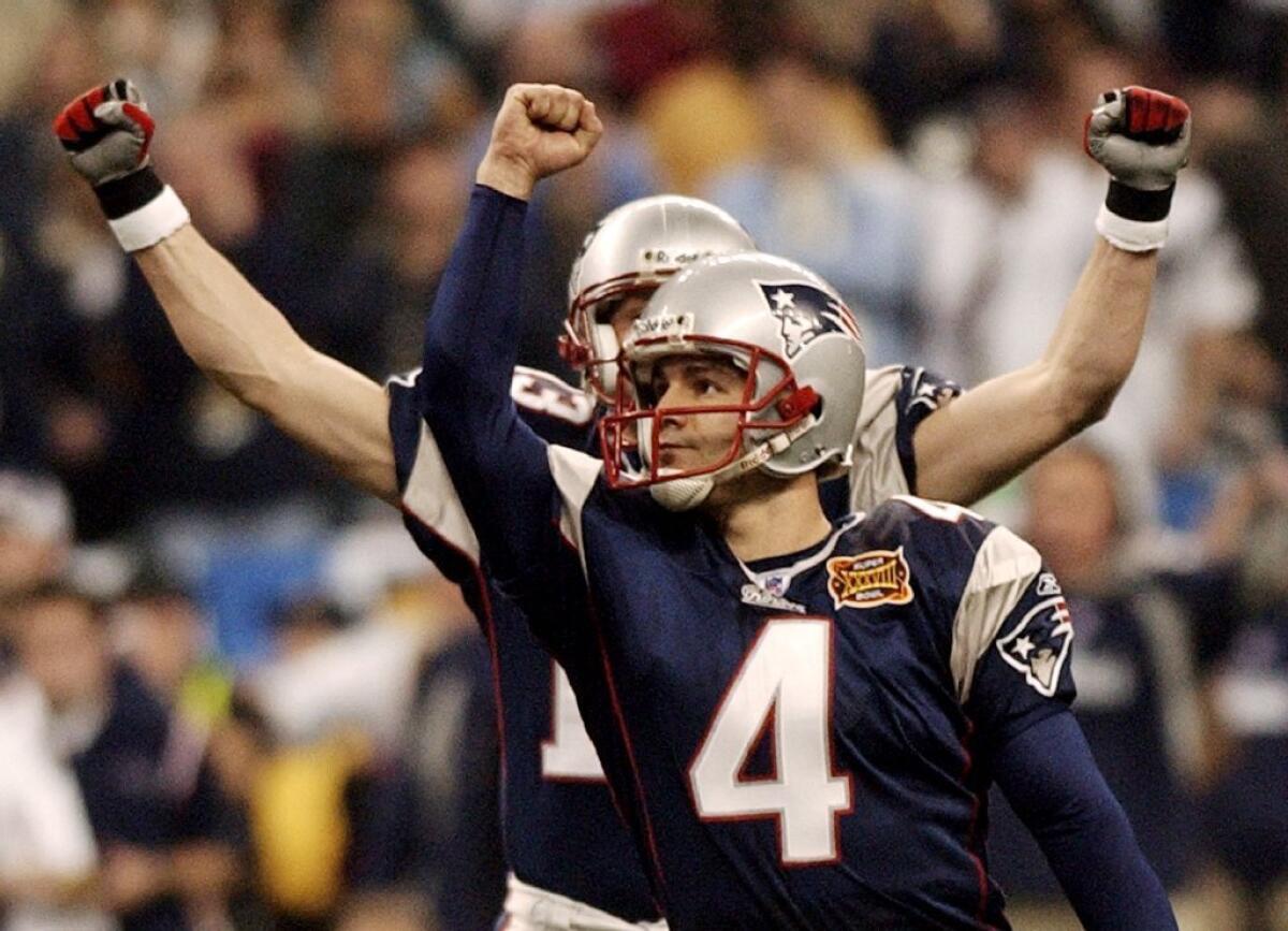 Patriots kicker Adam Vinatieri celebrates his game-winning field goal over the Panthers in Super Bowl XXXVIII on Feb. 1, 2004.