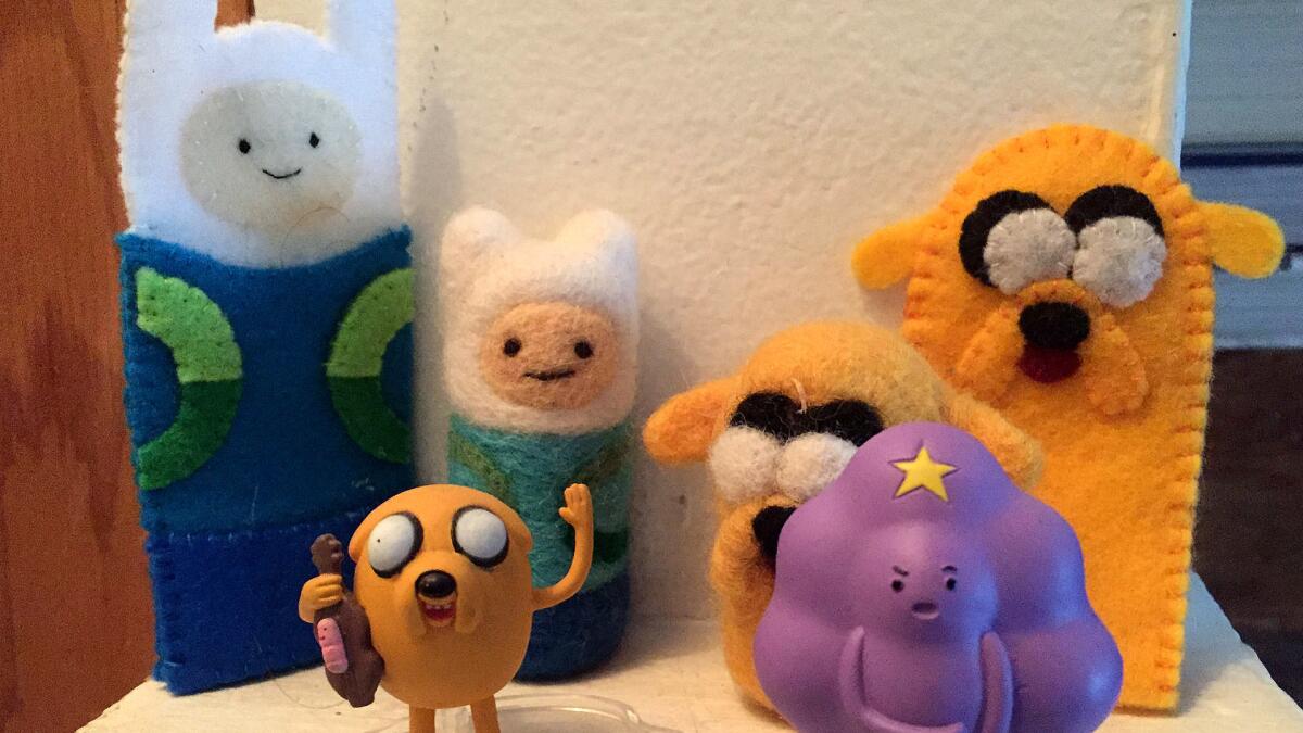 "Adventure Time" figures, official product and folk art, in the author's collection.