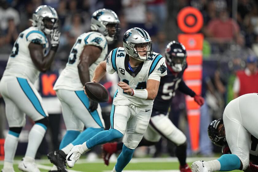 Carolina Panthers quarterback Sam Darnold (14) scrambles out of the pocket against the Houston Texans during the first half of an NFL football game Thursday, Sept. 23, 2021, in Houston. (AP Photo/Eric Christian Smith)