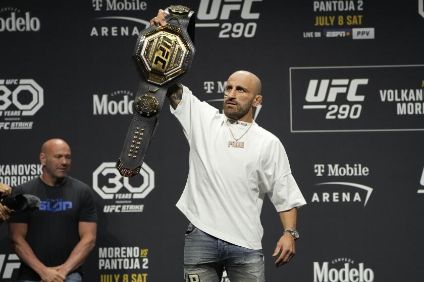 Alexander Volkanovski celebrates during a news conference for the UFC 290 Mixed Martial arts event Thursday, July 6, 2023, in Las Vegas. Volkanovski is scheduled to fight Yair Rodriguez in a featherweight championship bout Saturday in Las Vegas. (AP Photo/John Locher)