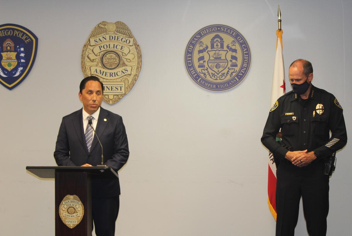 Mayor Todd Gloria speaks alongside police Chief David Nisleit Friday night a news conference at San Diego police headquarters