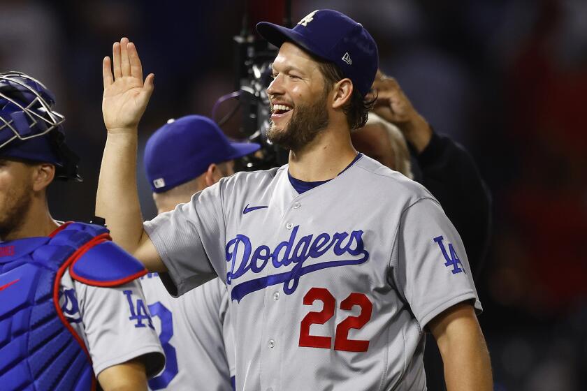 ANAHEIM, CALIFORNIA - JULY 15: Clayton Kershaw #22 of the Los Angeles Dodgers celebrates.