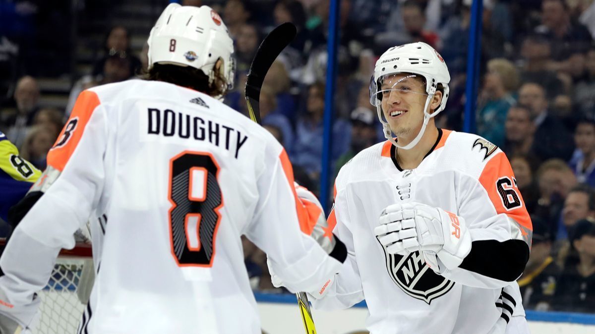 Pacific Division's Rickard Rakell, right, of the Ducks, is congratulated by Drew Doughty, of the Kings, after scoring during one of the NHL All-Star matchups Sunday.