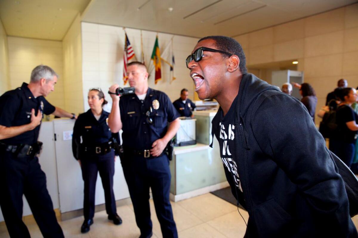 An L.A. Police Commission meeting last year is disrupted by members of Black Lives Matter L.A.