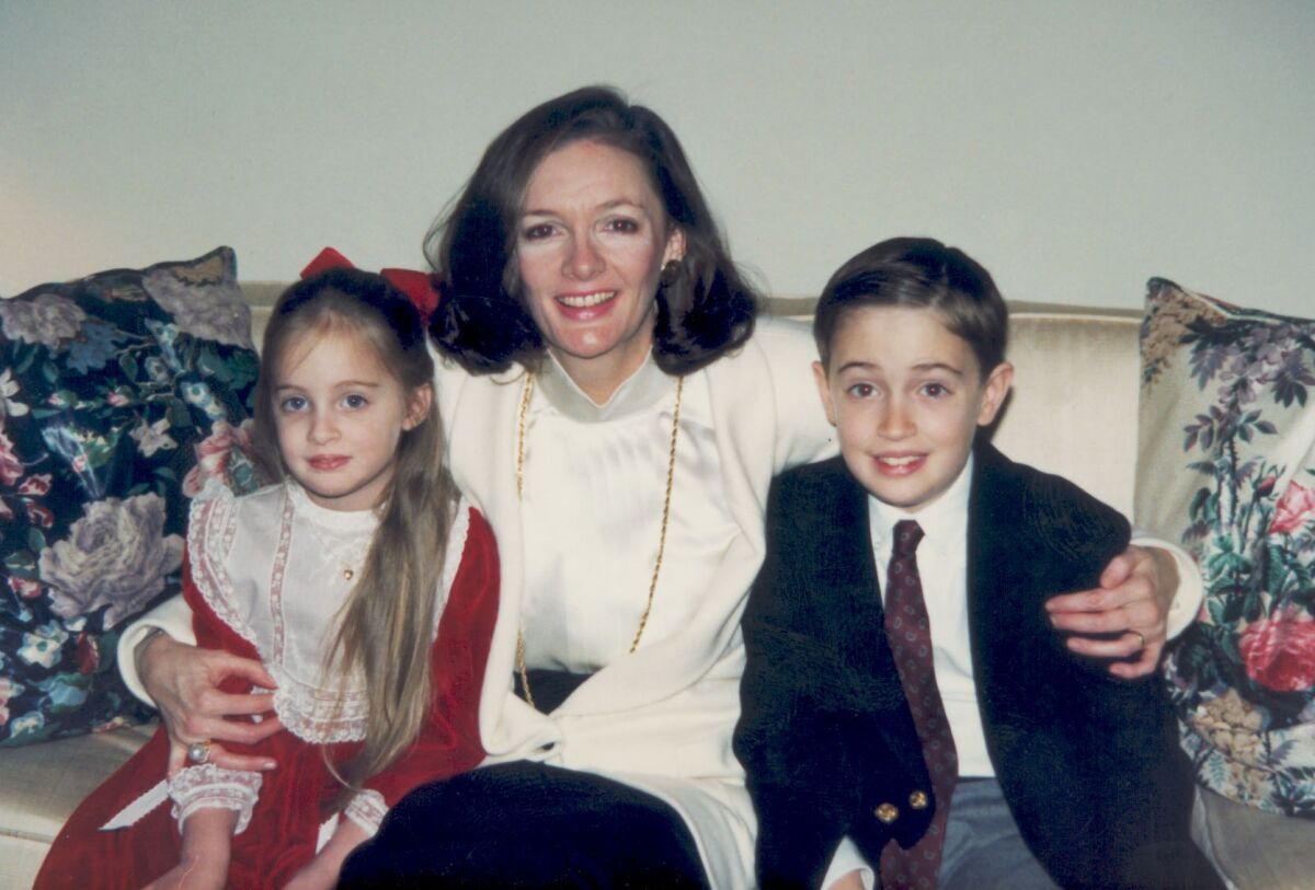 Ted Adderley is pictured as a boy with his mother, Mary Beth, and sister, Elizabeth.
