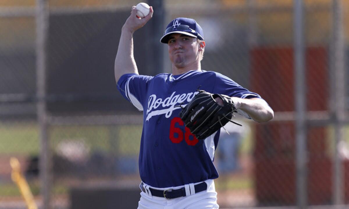 Dodgers pitcher Ross Stripling takes part in a spring-training practice session Feb. 10. The Dodgers have not yet set a timetable for Stripling's return from elbow surgery, which was performed Wednesday.