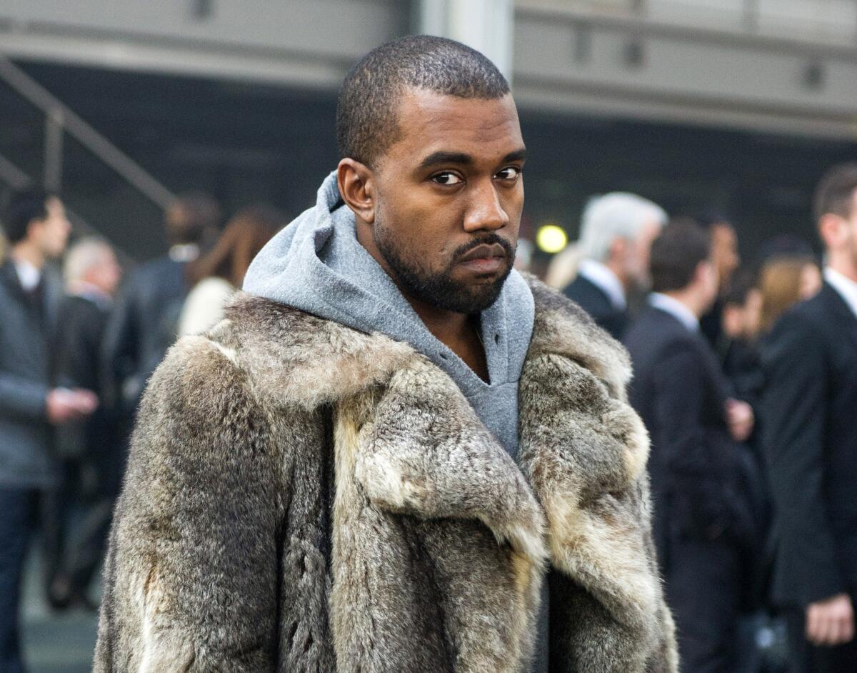 Kanye West, shown during Paris Fashion Week in January, had a no-contest plea entered on his behalf in the case of battery on a paparazzo in July at LAX.