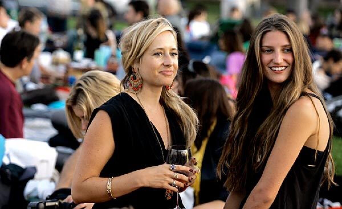 London socialite Tamsin Lonsdale, left, chats with Michele Ouellet. Lonsdale runs Supper Club.