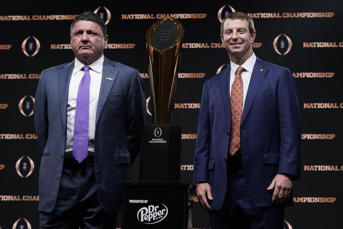Louisiana State coach Ed Orgeron and Clemson coach Dabo Swinney, right, will go head to head on Monday in the College Football Playoff National Championship Game.