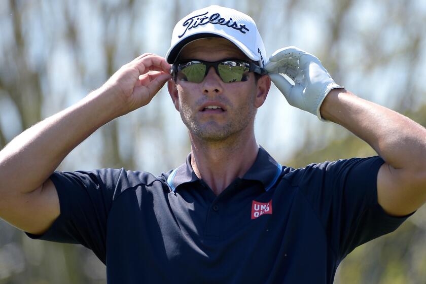 Adam Scott adjusts his sunglasses before teeing off on the 10th hole during the third round of the Arnold Palmer Invitational in Orlando, Fla., on March 21.