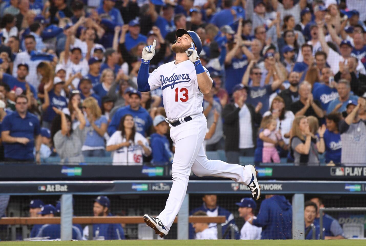 LOS ANGELES, OCTOBER 4, 2018-Dodgers Max Muncy celebrates his three-run home run against the Braves in the 2nd inning in Game 1 of the NLDS at Dodger Stadium Thursday. (Wally Skalij/Los Angeles Times)