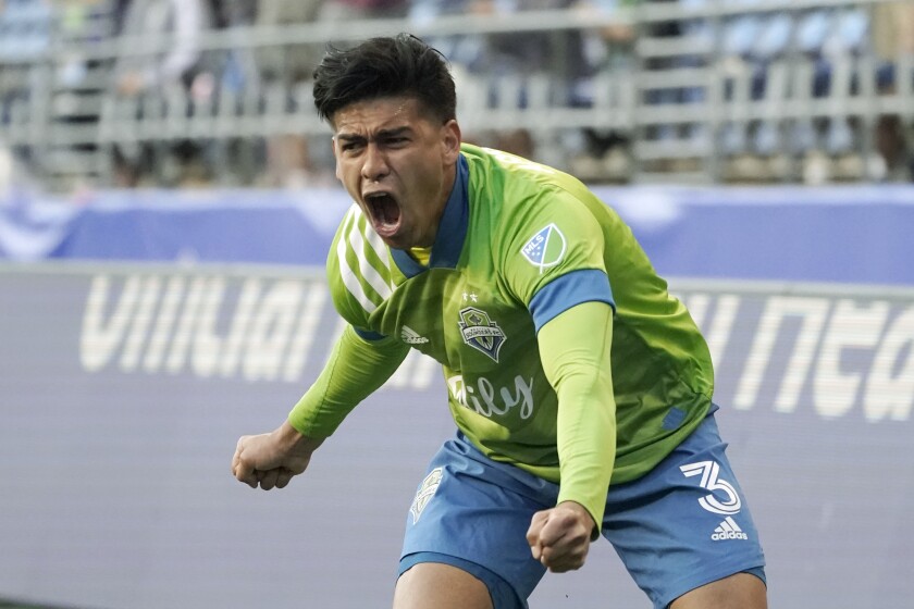 Seattle Sounders defender Xavier Arreaga celebrates after scoring a goal against Los Angeles FC during the second half of an MLS soccer match, Sunday, May 16, 2021, in Seattle. The goal was Arreaga's first career MLS goal. (AP Photo/Ted S. Warren)