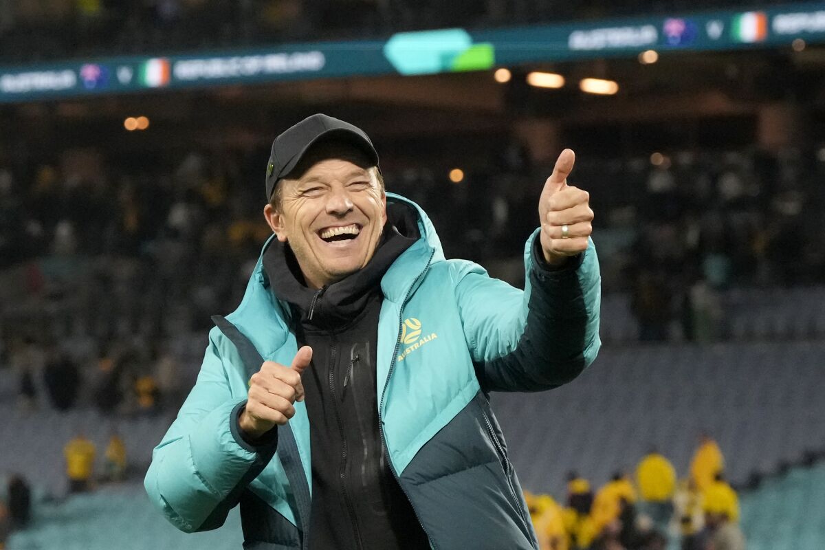 Australia coach Tony Gustavsson celebrates at the end of a 1-0 World Cup win over Ireland 