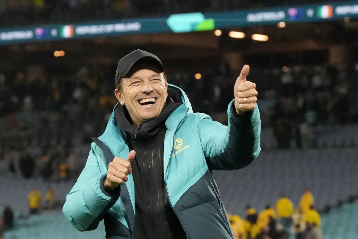 Australia coach Tony Gustavsson celebrates at the end of a 1-0 World Cup win over Ireland