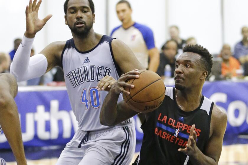 Clippers forward Jordan Hamilton looks for a way to the basket against Thunder forward James Southerland during an NBA summer league game in July.