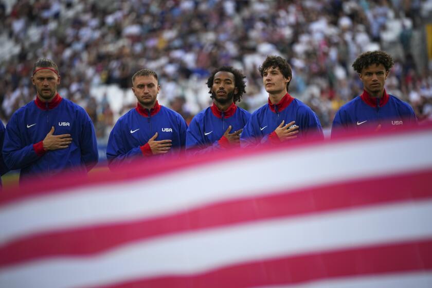 The United States men's soccer team sings the national anthem before the start of the men's Group A soccer match between New Zealand and the United States at the Velodrome stadium, during the 2024 Summer Olympics, Saturday, July 27, 2024, in Marseille, France. (AP Photo/Daniel Cole)