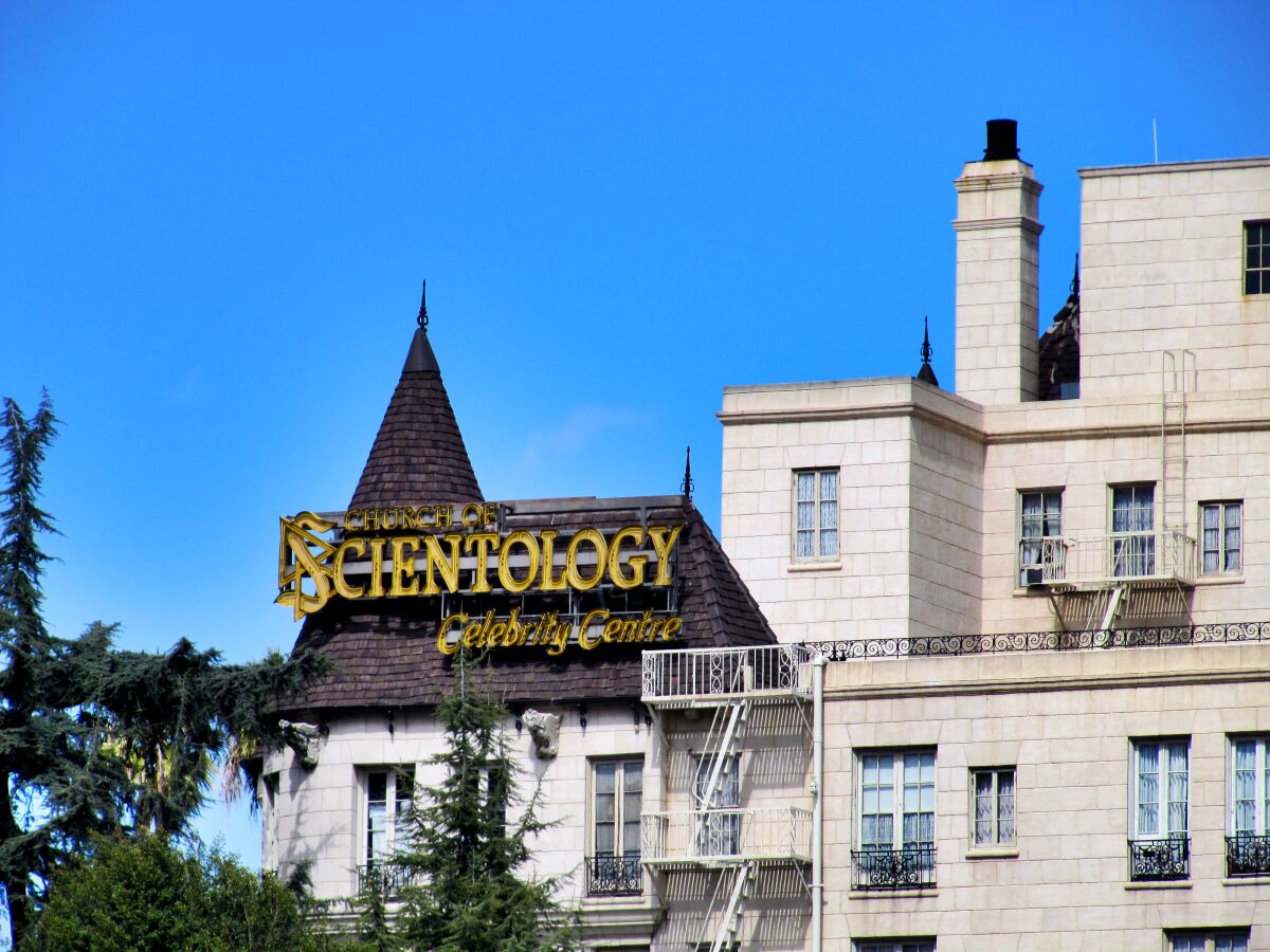 outside of a building with a Scientology sign