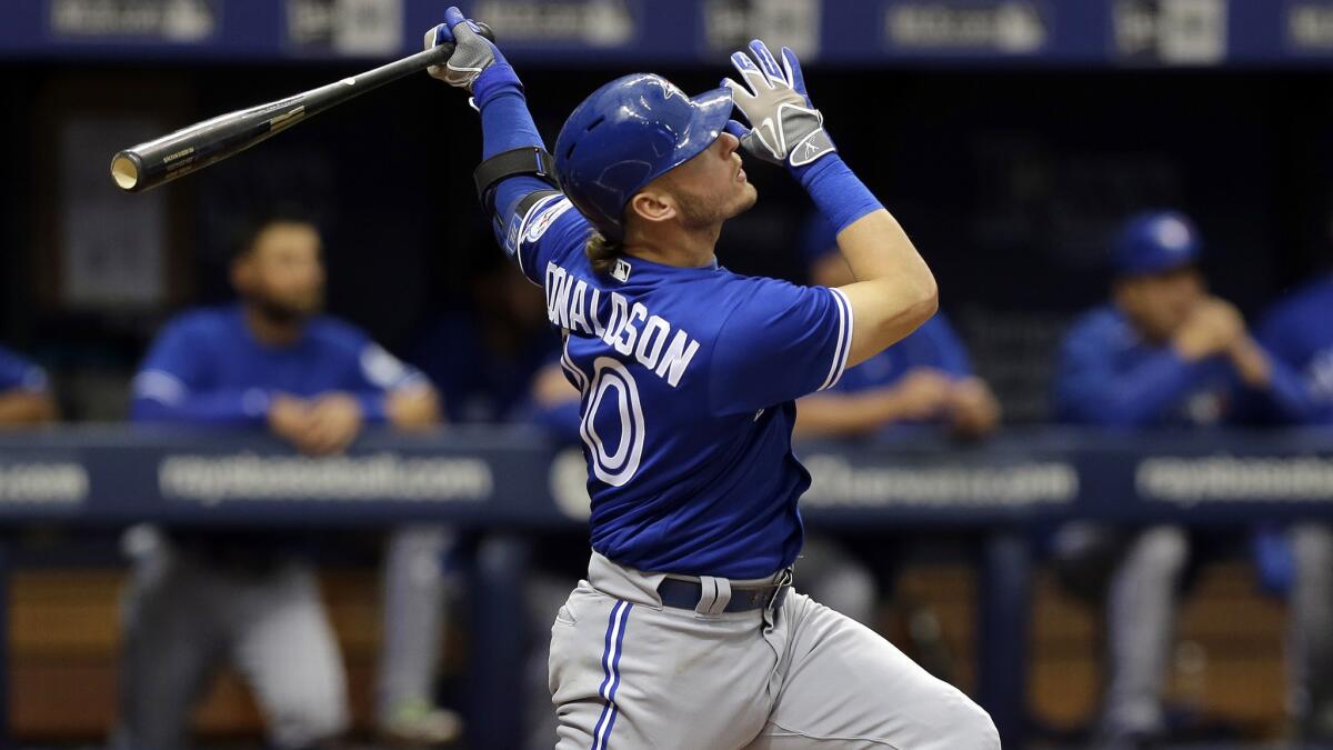 Blue Jays third baseman Josh Donaldson watches his three-run home run against the Rays on Wednesday.