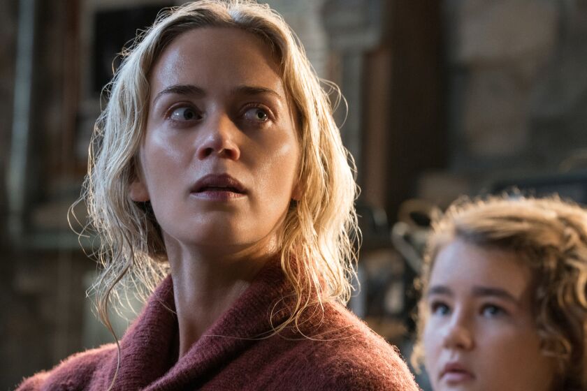 (L-R) - Emily Blunt plays Evelyn Abbott and Millicent Simmonds plays Regan Abbott in "A QUIET PLACE," from Paramount Pictures. Credit: Jonny Cournoyer / Paramount Pictures