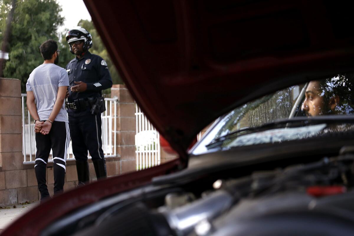 LAPD Officer Will Durr tickets a motorist in Granada Hills in 2015.