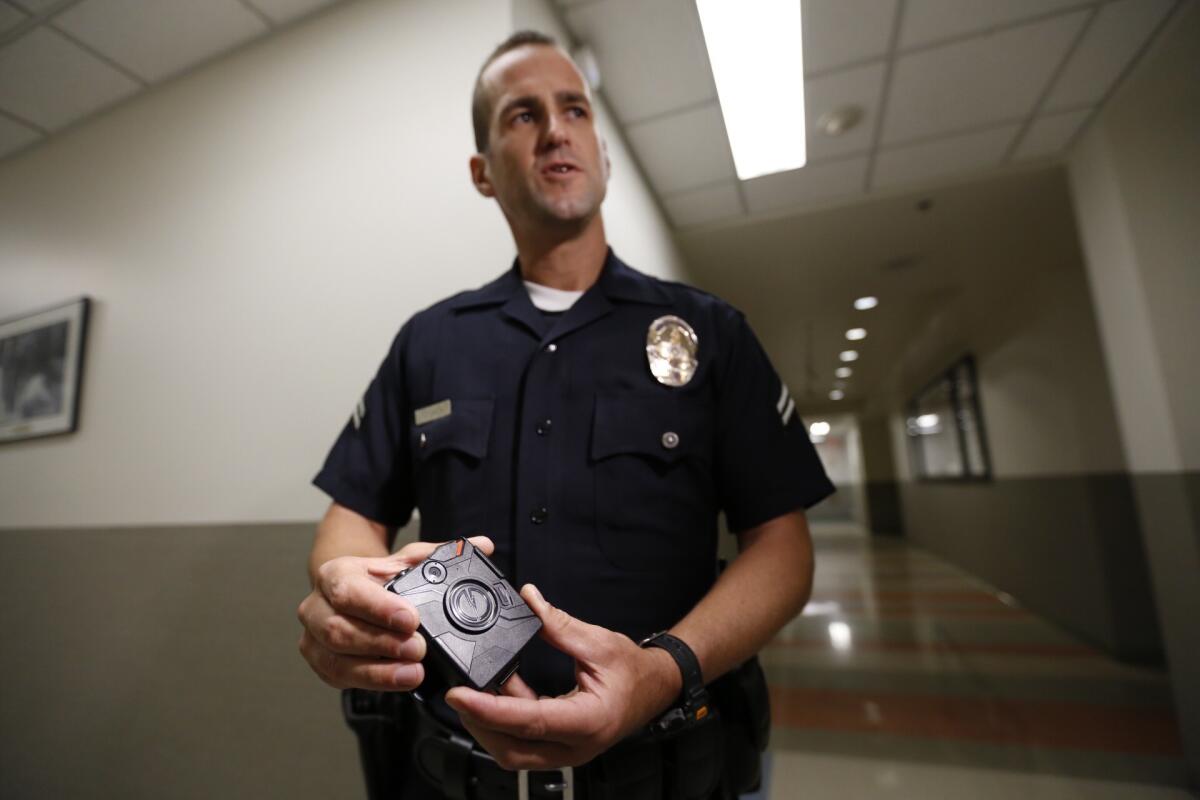 Officer Jim Stover demonstrated the use of a body camera at the LAPD's Mission Division in August.