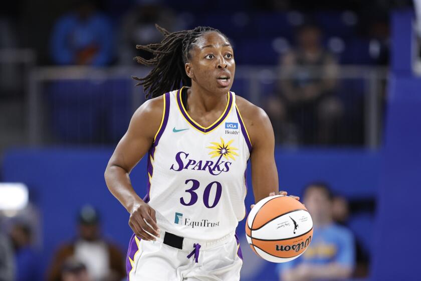 Sparks forward Nneka Ogwumike brings the ball up the court against the Chicago Sky on May 6, 2022, in Chicago.