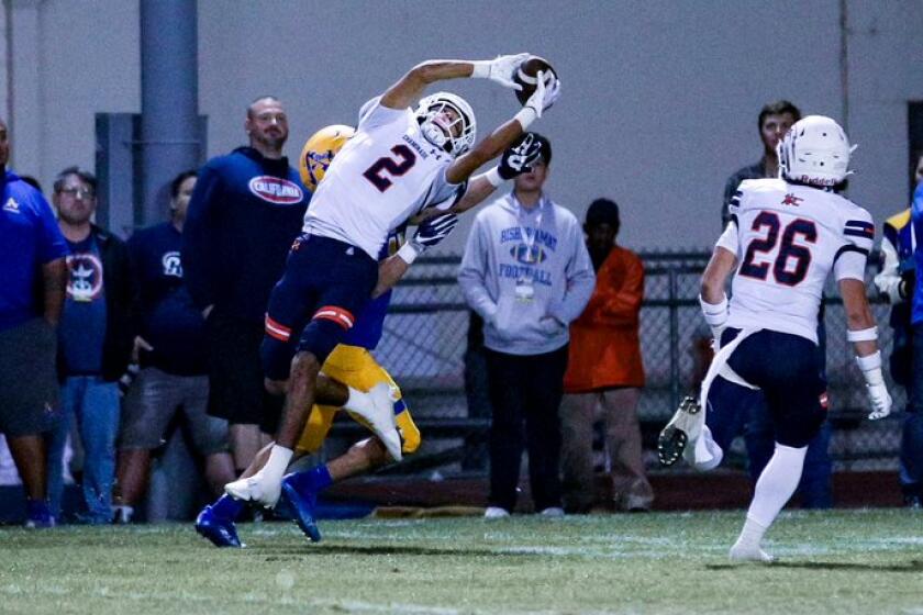 Marquis Gallegos of No. 7-ranked Chaminade makes one of his two interceptions against Bishop Amat.