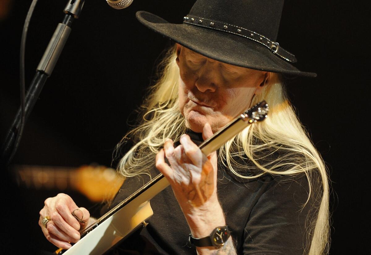 Johnny Winter seen performing on stage during in 2008 at the XII Jazz Festival in Valencia's Palau de la Musica. Winter died at the age of 70 in a hotel in Zurich.