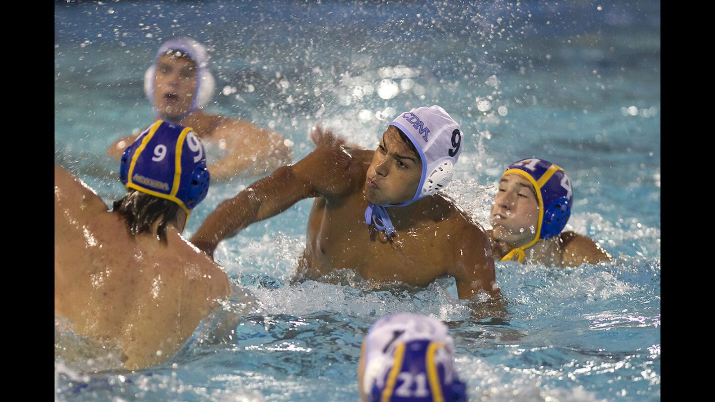 CDM's Matthew Schildwachter, 9, shoots and scores in front of the net and surrounded by Agoura defenders for a goal during the boys southern section div-2 semi final game on Wednesday.