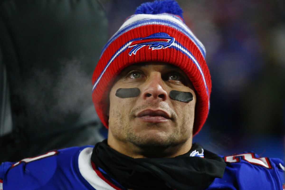 FILE - Buffalo Bills free safety Jordan Poyer (21) looks on during the second half of an NFL wild-card playoff football game against the New England Patriots in Orchard Park, N.Y., Saturday, Jan. 15, 2022. Bills safety Jordan Poyer will attend and participate in Buffalo's mandatory practices this week after sitting out all of the team's voluntary spring sessions because of a contract issue, a person with direct knowledge of the player's decision told The Associated Press on Monday, June 13, 2022.(AP Photo/ Jeffrey T. Barnes, File)