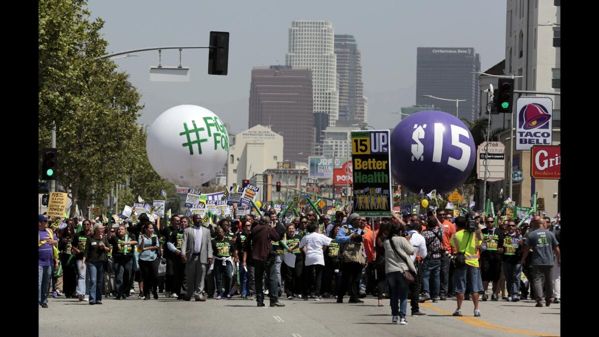 Fight for 15 protesters march down Figueroa Street in Los Angeles during a 2015 rally.
