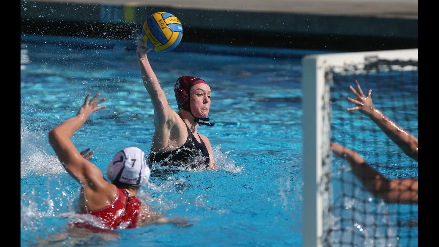 Laguna's Isabel Riches scores early in the semifinals of the Irvine Southern California Championships water polo tournament against Mater Dei at Woollett Aquatics Center on Saturday.