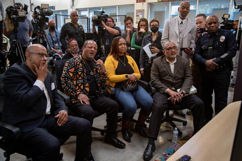 LOS ANGELES, CA - JANUARY 27, 2023: Community civic leaders react while watching the video of Tyre Nichols being beaten by Memphis Police at the Leimert Park Community Building on January 27, 2023 in Los Angeles, California. From the left: Ernest Williams, Najee Ali, Laura King, daughter of Rodney King, Robert Sausedo and LAPD Deputy Chief Gerald Woodyard.(Gina Ferazzi / Los Angeles Times)