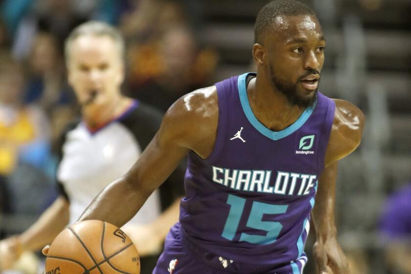 Charlotte Hornets' Kemba Walker (15) dribbles ther ball up-court against the Cleveland Cavaliers during the first half of an NBA basketball game in Charlotte, N.C., Saturday, Nov. 3, 2018. The Hornets won 126-94. (AP Photo/Bob Leverone)