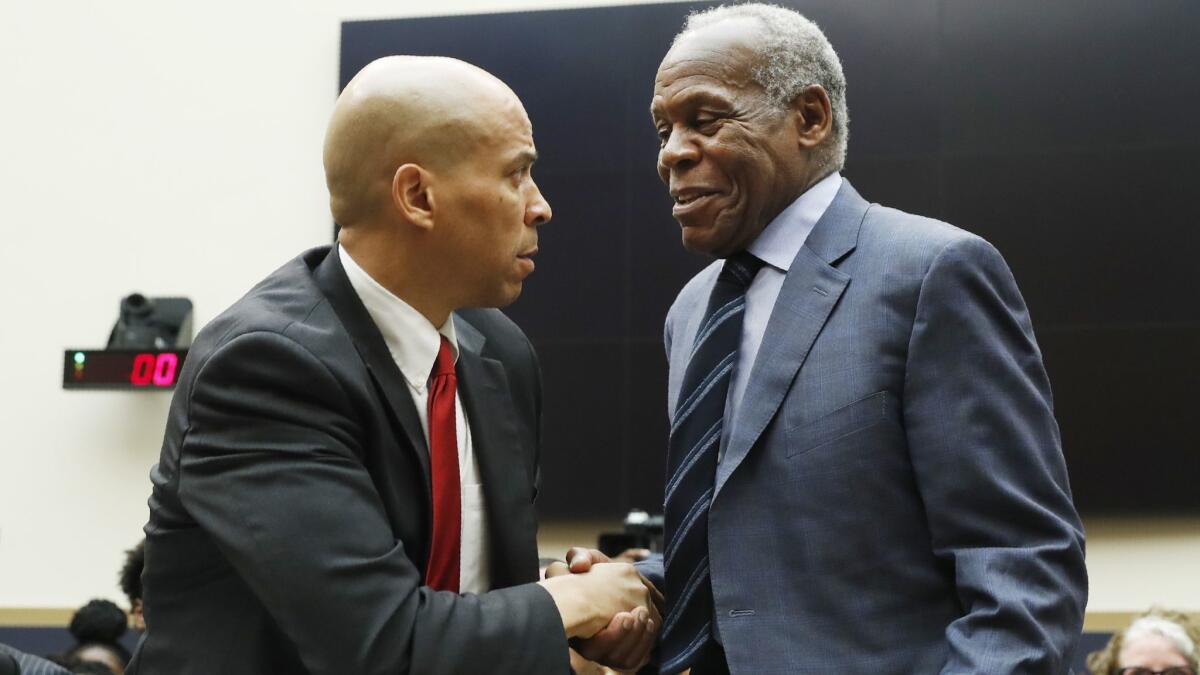 Sen. Cory Booker, left, and actor Danny Glover testified June 19 before a House Judiciary panel.