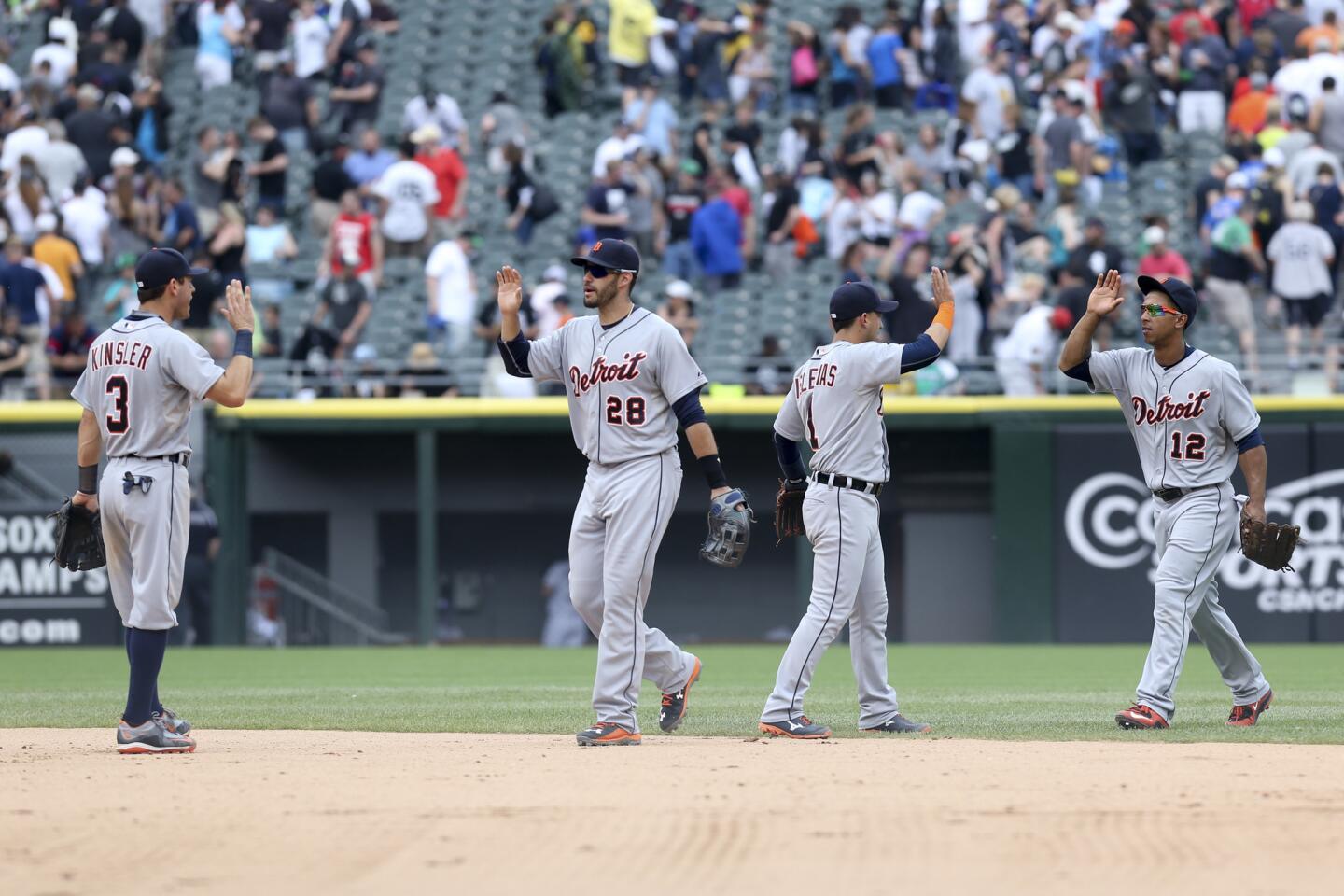 Tigers players celebrate after defeating the White Sox.