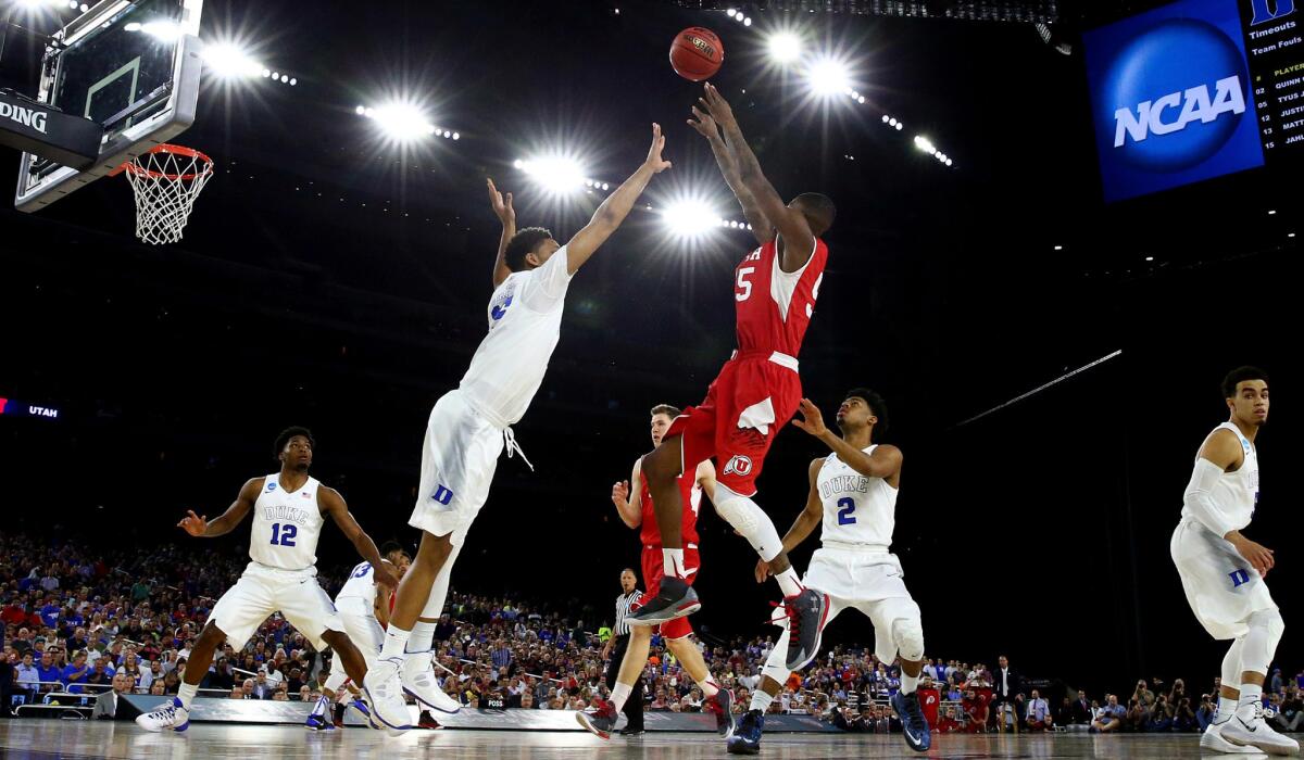 Utah forward Delon Wright pulls up for a jumper against Duke in the cavernous NRG Stadium in Houston.